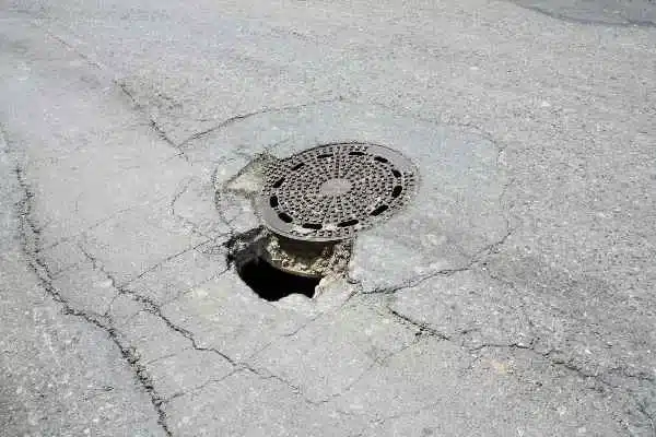 A deep pothole on a Texas road that has not been fixed