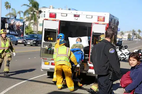 Emergency staff transporting an injured person.