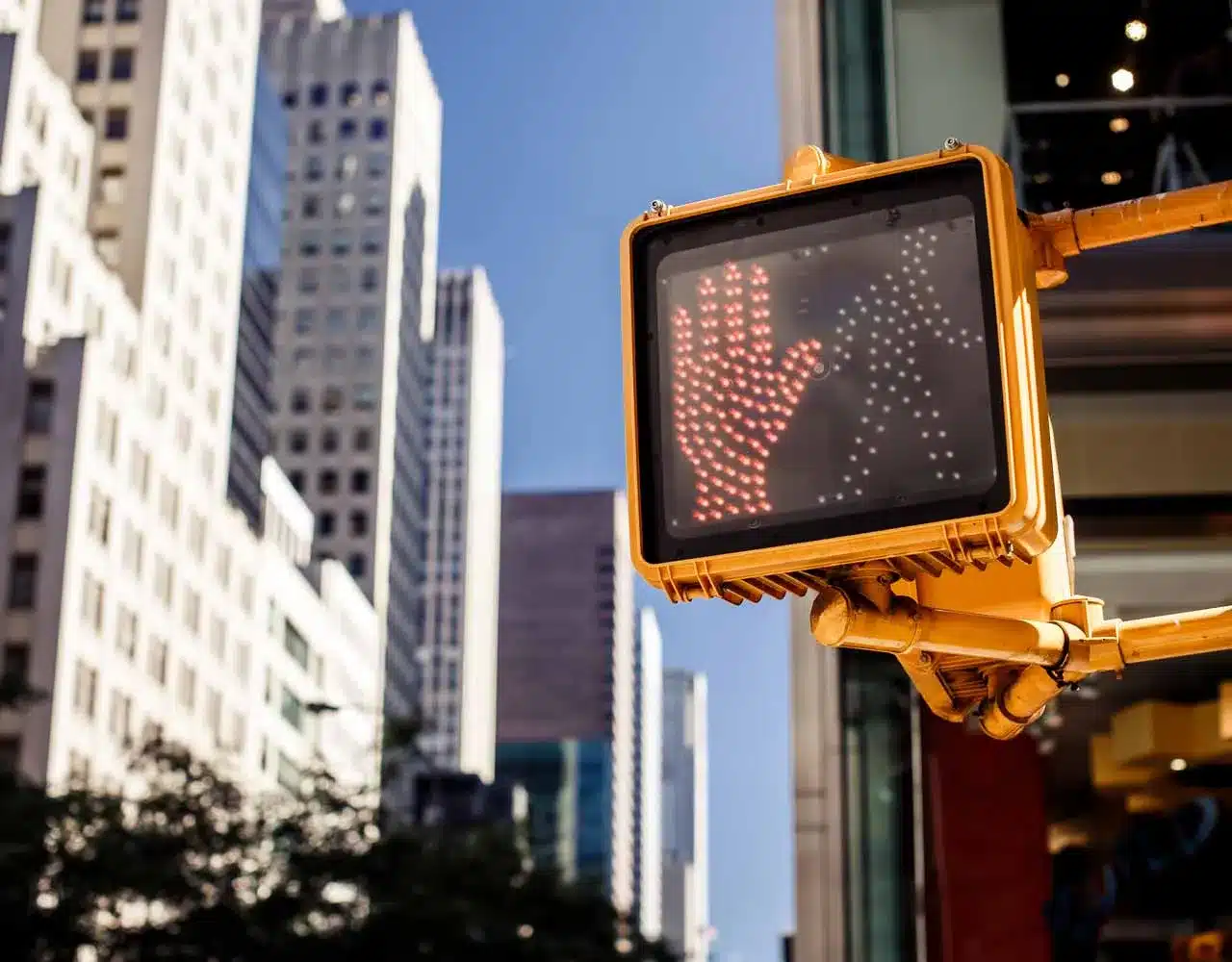 A pedestrian light in an urban environment.