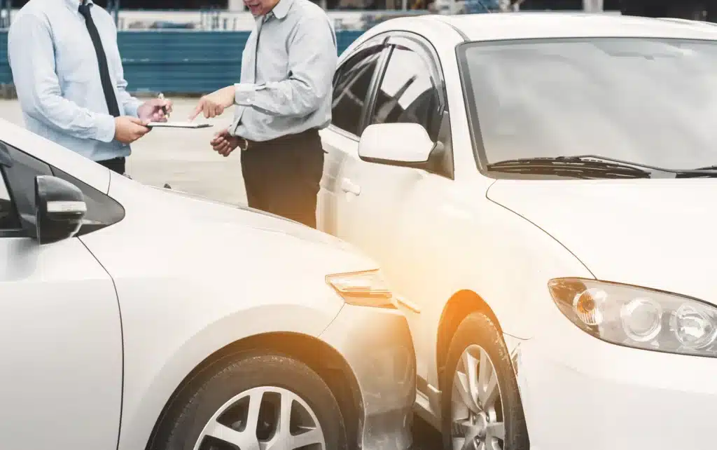 Two people exchanging information after an accident.